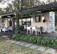 Absolute riverfront shipping container cabin - Great Ocean Road Tourism